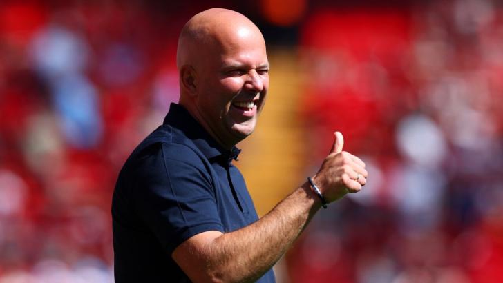 Liverpool manager Arne Slot gives the thumbs up to his side